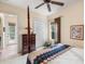 Bedroom features a four poster bed, closet, and access to the lanai at 8308 Mobile Cir, Weeki Wachee, FL 34613