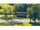The Glen Lakes community sign with meticulously maintained landscaping and greenery at 8308 Mobile Cir, Weeki Wachee, FL 34613