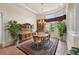 Elegant dining room featuring a chandelier, rug, and large windows offering natural light at 8308 Mobile Cir, Weeki Wachee, FL 34613