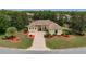 Charming single-story home with lush landscaping, brick driveway, and inviting curb appeal at 8308 Mobile Cir, Weeki Wachee, FL 34613