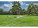 Community horseshoe pit with well-maintained green space, perfect for outdoor recreation and leisurely afternoons at 8308 Mobile Cir, Weeki Wachee, FL 34613