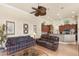 Bright living room with tile floors and a comfortable seating arrangement at 8308 Mobile Cir, Weeki Wachee, FL 34613