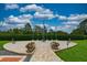 Veteran's Memorial with flags and flowers nestled within beautifully landscaped grounds at 8308 Mobile Cir, Weeki Wachee, FL 34613