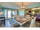 Bright dining room with modern lighting, views of the backyard, and a table that seats six at 8722 Thornwood Ln, Tampa, FL 33615