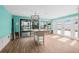 Bright dining room with tile flooring, pool views, and a chandelier at 8722 Thornwood Ln, Tampa, FL 33615