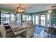 Bright dining room with modern lighting, views of the waterfront, and a table that seats six at 8722 Thornwood Ln, Tampa, FL 33615