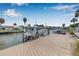 Private boat dock featuring space for boat lift and ample docking space against blue sky background at 8722 Thornwood Ln, Tampa, FL 33615