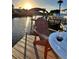 Waterfront view with a sunset provides a serene setting for relaxation at 8722 Thornwood Ln, Tampa, FL 33615