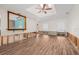 Open living room with bar pass-through to the kitchen at 8722 Thornwood Ln, Tampa, FL 33615