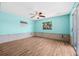 Spacious living area with tile flooring, ceiling fan, and water view at 8722 Thornwood Ln, Tampa, FL 33615