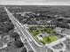 A black and white aerial view of the home, highlighting the address and property lines in a suburban neighborhood at 903 Tomahawk Trl, Brandon, FL 33511