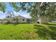 Well-maintained backyard featuring a screened enclosure, providing a great space for relaxation and entertainment at 903 Tomahawk Trl, Brandon, FL 33511