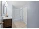 Well-lit bathroom featuring a shower-tub combo and a modern vanity at 903 Tomahawk Trl, Brandon, FL 33511