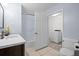 Bright bathroom with a shower-tub combo, toilet, and a vanity at 903 Tomahawk Trl, Brandon, FL 33511