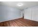 Bedroom featuring light-blue walls, hardwood floors, and a double closet at 903 Tomahawk Trl, Brandon, FL 33511
