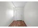 Simple entryway with laminate flooring, a white door and sidelight window at 903 Tomahawk Trl, Brandon, FL 33511