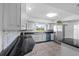 Kitchen with stainless steel appliances, granite countertops, and stylish cabinetry at 903 Tomahawk Trl, Brandon, FL 33511