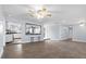 Spacious living room featuring tiled floors and an open design with access to the kitchen at 903 Tomahawk Trl, Brandon, FL 33511