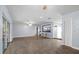 Open-concept living room with tile floors, light blue walls, and ample natural light at 903 Tomahawk Trl, Brandon, FL 33511