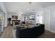 Spacious living room with open floor plan, seamlessly connecting to dining and kitchen areas at 903 Tomahawk Trl, Brandon, FL 33511