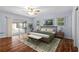 Bright main bedroom featuring a private balcony, providing a serene retreat with ample natural light at 903 Tomahawk Trl, Brandon, FL 33511