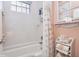 Bathroom featuring a shower and tub combination, a seashell-themed curtain, and ample storage at 919 Ballinger Rd, Lutz, FL 33548