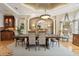 Formal dining room featuring elegant lighting, neutral paint colors, and lots of seating at 919 Ballinger Rd, Lutz, FL 33548