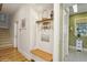 Inviting entryway with a built-in bench, coat rack, and decorative accents, creating a welcoming atmosphere at 919 Ballinger Rd, Lutz, FL 33548