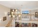Foyer with a large chandelier, grand staircase, and water views at 919 Ballinger Rd, Lutz, FL 33548