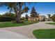 Beautiful home showcasing a lush lawn, large trees, and a circular driveway leading to a well-maintained property at 919 Ballinger Rd, Lutz, FL 33548