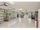 Spacious three car garage featuring ample storage and room for workspace at 919 Ballinger Rd, Lutz, FL 33548