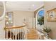 Open hallway space with lots of natural light and beautiful architecture and wood flooring at 919 Ballinger Rd, Lutz, FL 33548