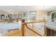 Upstairs hallway space with lots of natural light, wooden floors and stairs at 919 Ballinger Rd, Lutz, FL 33548