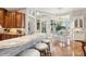 Open kitchen and dining area with bar seating and waterfront view at 919 Ballinger Rd, Lutz, FL 33548