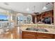 Spacious open-concept kitchen with an island, lake views, and seamless transition to living spaces at 919 Ballinger Rd, Lutz, FL 33548