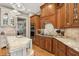 Gourmet kitchen with custom wood cabinetry, granite countertops and stainless steel appliances at 919 Ballinger Rd, Lutz, FL 33548