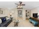 Nautical themed living room featuring comfortable seating, decor, and seamless flow to bedroom at 919 Ballinger Rd, Lutz, FL 33548