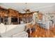 Open-concept living area with custom built-ins, hardwood floors, and a cozy seating arrangement at 919 Ballinger Rd, Lutz, FL 33548