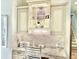 Built in office nook features granite counters, custom cabinets, decorative backsplash and fixtures at 919 Ballinger Rd, Lutz, FL 33548