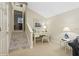 Bright office with a desk, chair, and nautical decor leading to a staircase at 919 Ballinger Rd, Lutz, FL 33548