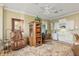 Charming office featuring a cozy leather chair, custom bookcase, and built-in desk with white cabinetry at 919 Ballinger Rd, Lutz, FL 33548