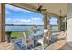 Covered outdoor patio with lake views, perfect for dining and relaxation at 919 Ballinger Rd, Lutz, FL 33548
