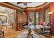 Sitting area with hardwood floors, red walls, and views to formal dining room at 919 Ballinger Rd, Lutz, FL 33548