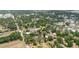 Aerial view showcasing the property nestled in a quiet, tree-lined residential area with mature landscaping at 1010 Oakhill St, Seffner, FL 33584