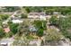 An aerial view showing the property with a large, tree-filled yard and nearby residential streets at 1010 Oakhill St, Seffner, FL 33584