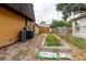 Backyard area featuring a garden and the home's mechanical equipment at 1010 Oakhill St, Seffner, FL 33584