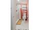 Unique bathroom with pink walls, stand up shower, and modern toilet with shelving at 1010 Oakhill St, Seffner, FL 33584