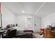 Simple bedroom design with desk, bed, and an outdoor access door at 1010 Oakhill St, Seffner, FL 33584