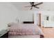 This bedroom features a ceiling fan, wood floors, and plenty of natural light at 1010 Oakhill St, Seffner, FL 33584
