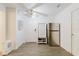 Bright entryway features modern fixtures, ceiling fan, and gray wood-look flooring at 1010 Oakhill St, Seffner, FL 33584